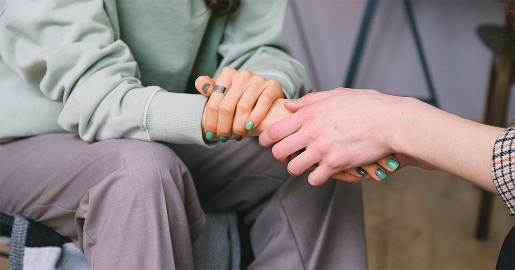 Banner of patient and therapist holding hands